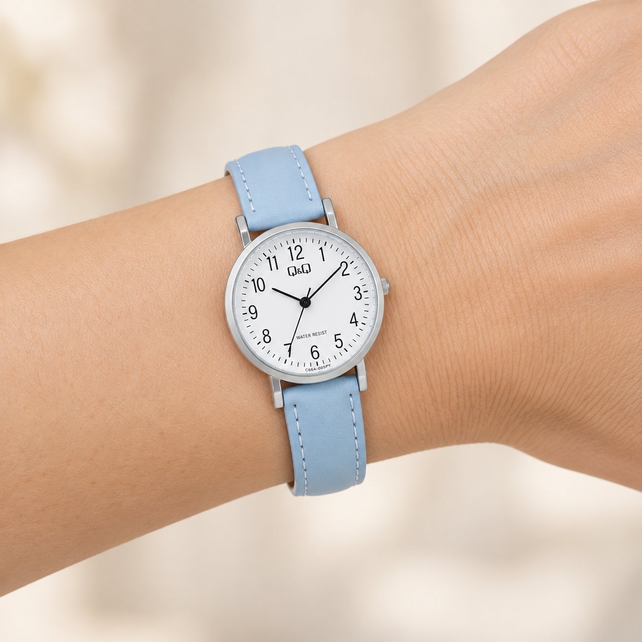 RELOJ QYQ C66A-005PY PARA MUJER COLOR CELESTE CORREA SINTÉTICA ESFERA BLANCA 28 MM 3 BAR - 4