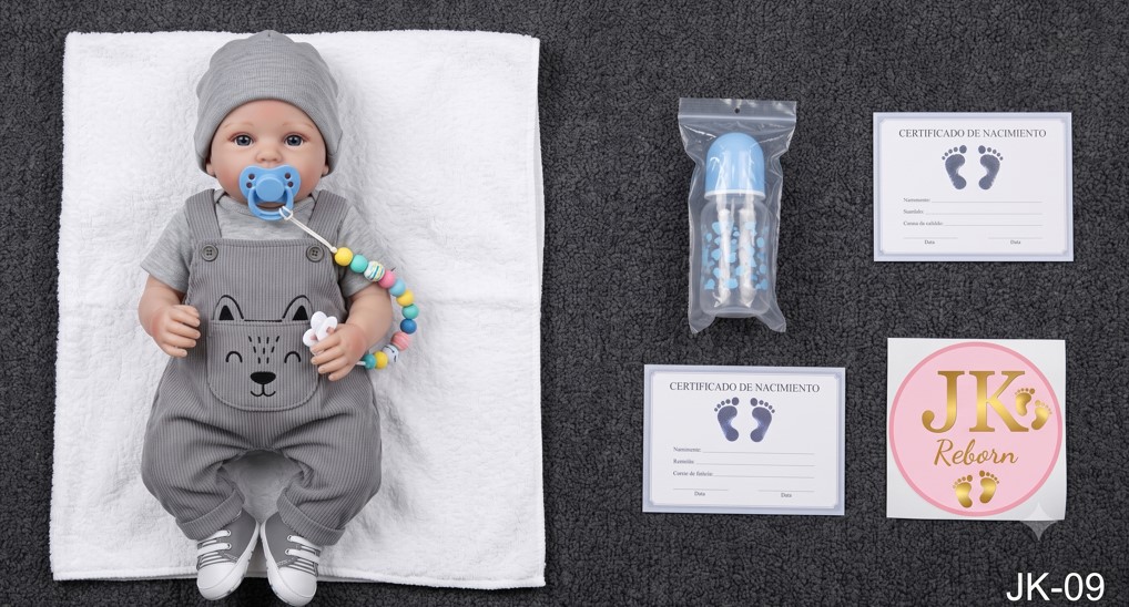 MUÑECA REBORN DE COLECCIÓN CON VESTIDO DE ALTA COSTURA BORDADO Y PERLAS - 1