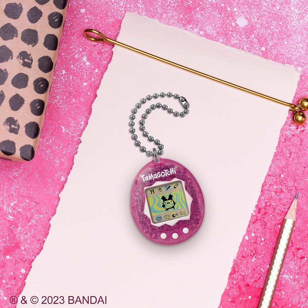 TAMAGOTCHI ORIIGINAL PURPURINA ROSA LOGO ACTUALIZADO - 2