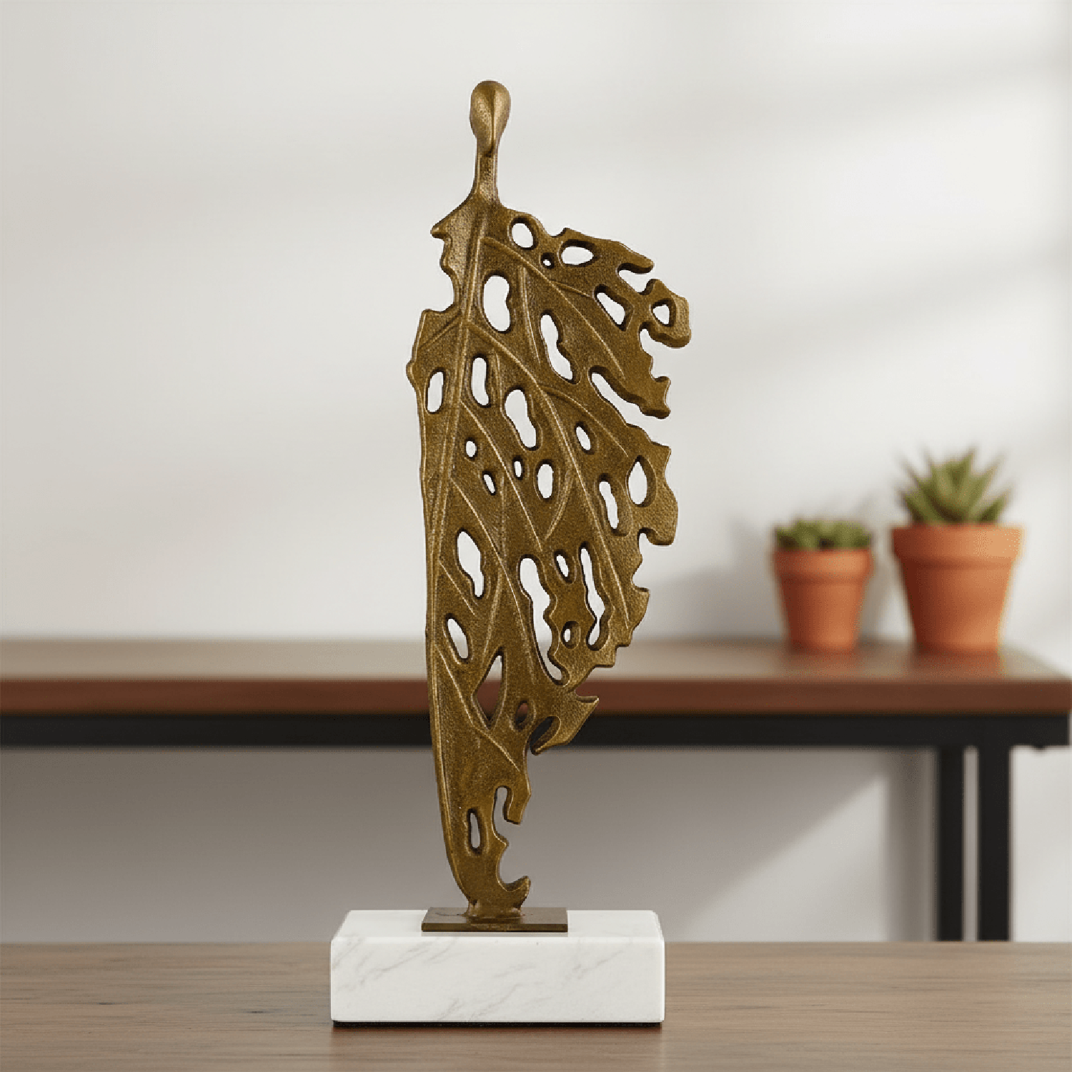 ADORNO ESCULTURA HOMBRE HOJA - 1