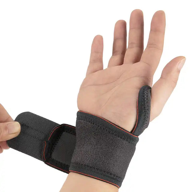 MUÑEQUERA DE POTENCIA Y COMPRESIÓN NEGRO CON NARANJA PAR - 1