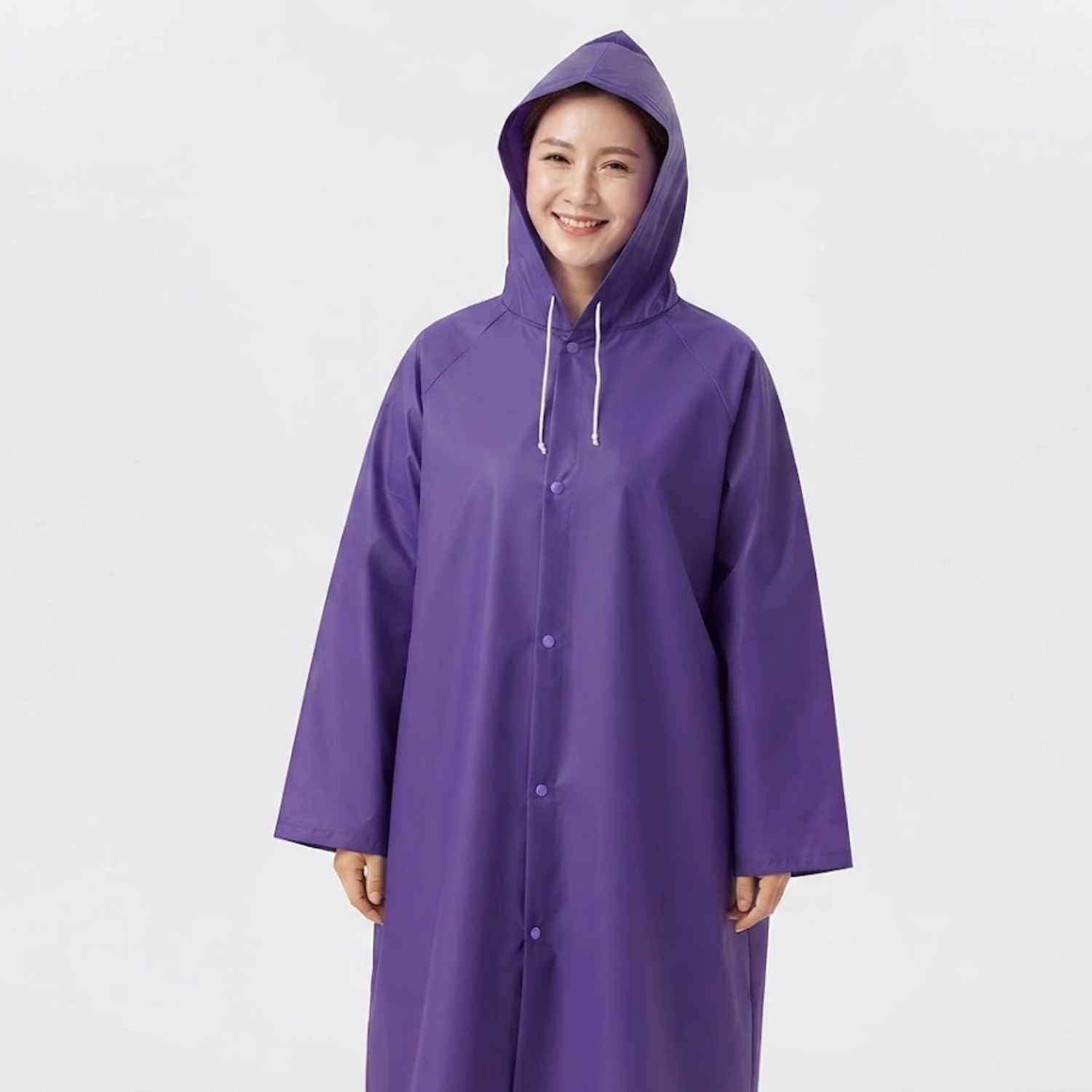 PONCHO PARA LLUVIA CON CAPUCHA MORADA - 1