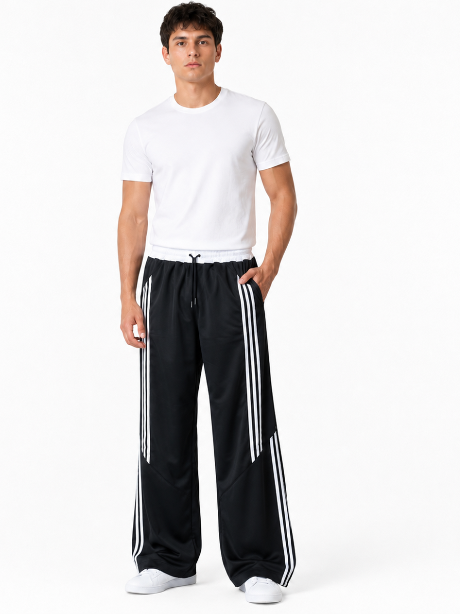 PANTALÓN DEPORTIVO PARA HOMBRE DE CORTE AMPLIO CON FRANJAS LATERALES, CINTURA ELÁSTICA Y DISEÑO URBANO CÓMODO Y MODERNO JOVEN - 1