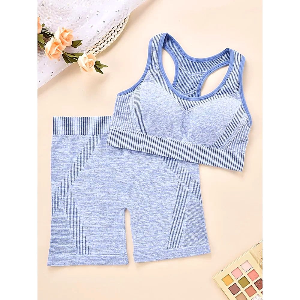 SET DEPORTIVO MUJER TOP Y SHORTS CELESTE CON ESPALDA CRUZADA Y CINTURA ELASTICA - 1