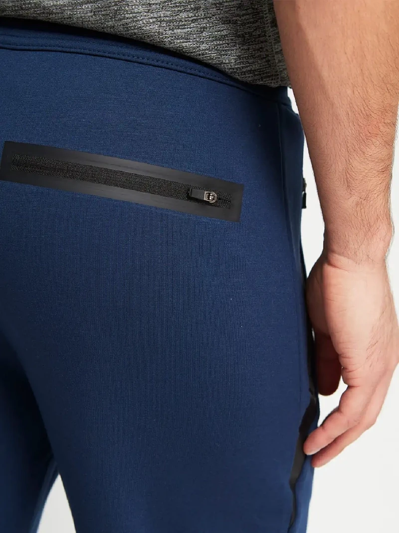 PANTALÓN BUZO HOMBRE REVUP CORTES - 3